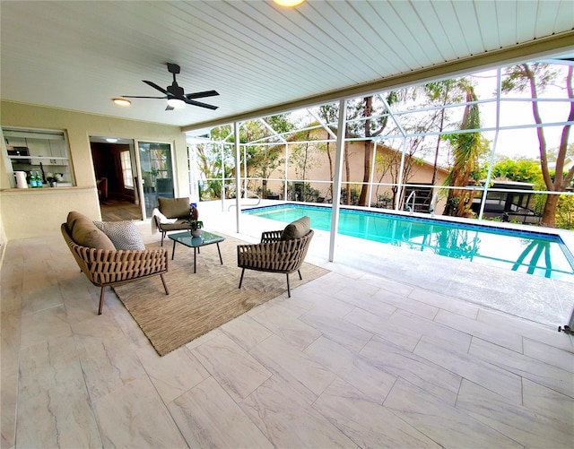 view of pool with a ceiling fan, a lanai, a patio, and a fenced in pool