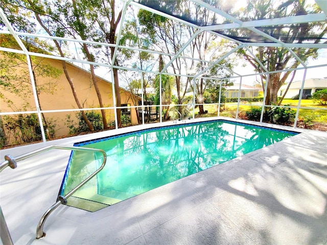 pool featuring a lanai and a patio