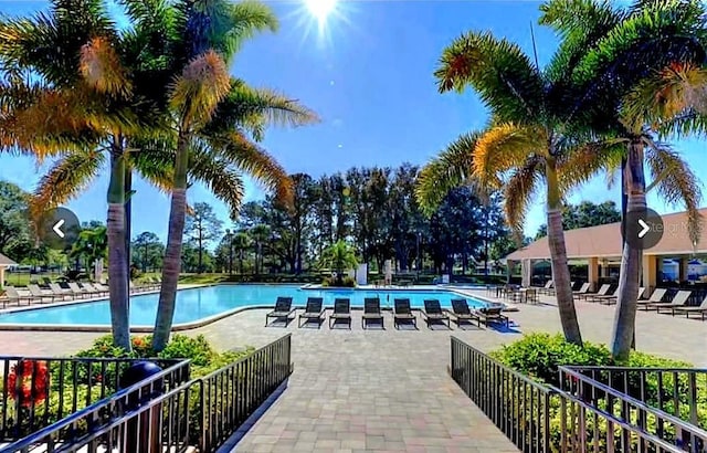 community pool with a patio