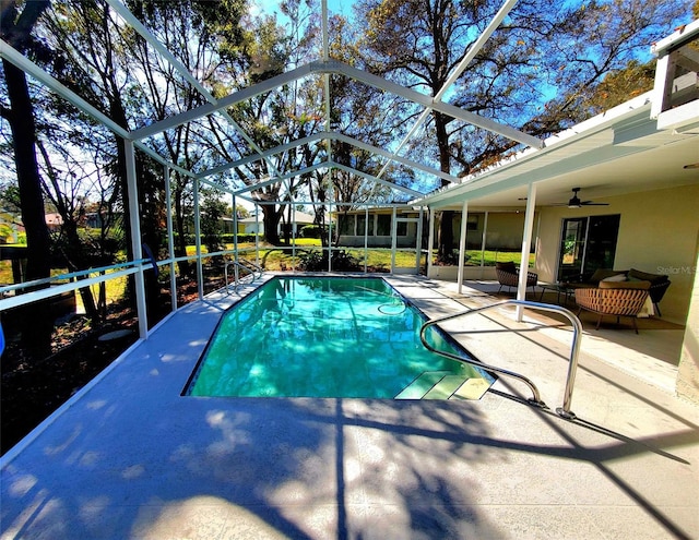 pool featuring ceiling fan, a patio, and a lanai