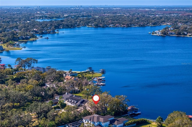 birds eye view of property with a water view