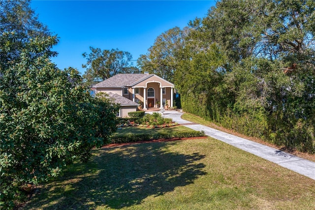 view of front of property with a porch and a front lawn