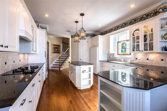 kitchen with white cabinetry and a center island