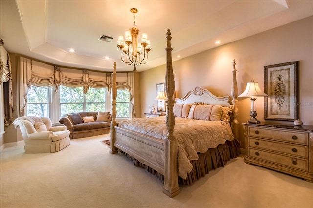 bedroom featuring carpet floors, an inviting chandelier, and a raised ceiling