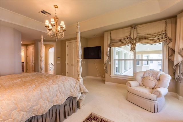 bedroom featuring carpet flooring and an inviting chandelier