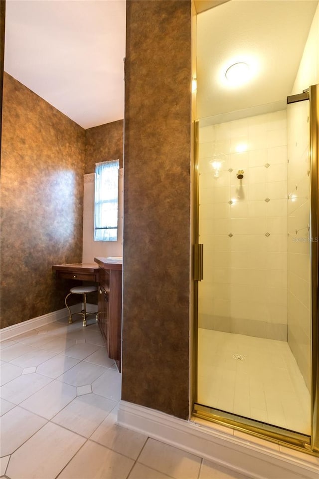 bathroom with tile patterned flooring, vanity, and a shower with shower door