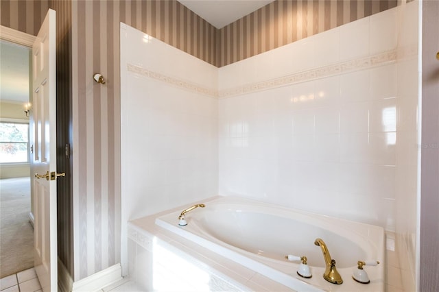 bathroom featuring tile patterned floors and a relaxing tiled tub