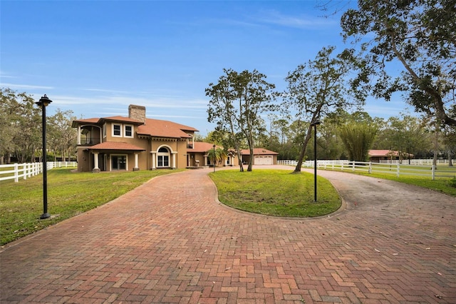 view of front facade featuring a garage and a front yard