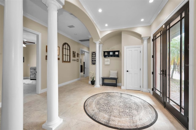 tiled entrance foyer featuring ornamental molding