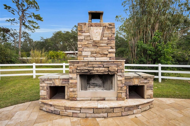 view of patio / terrace with an outdoor stone fireplace