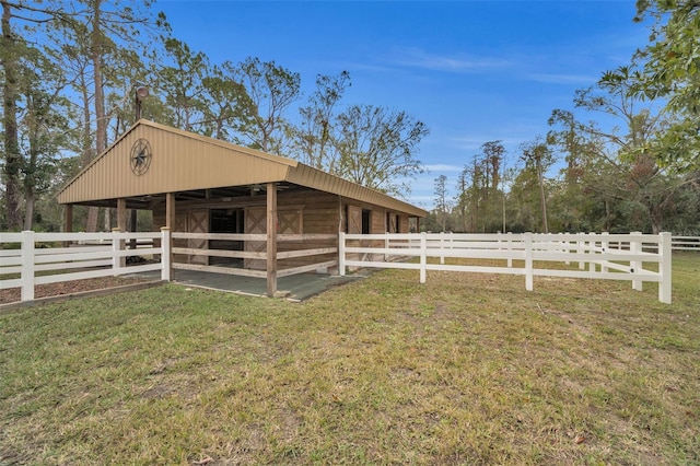 view of side of property featuring an outbuilding