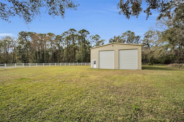 view of yard with an outbuilding and a garage