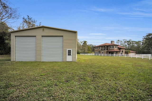 garage with a lawn