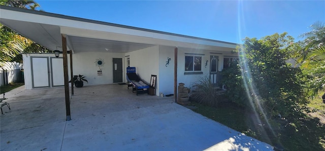 exterior space featuring a carport