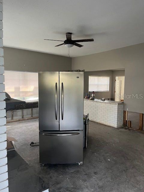 kitchen featuring stainless steel refrigerator and ceiling fan