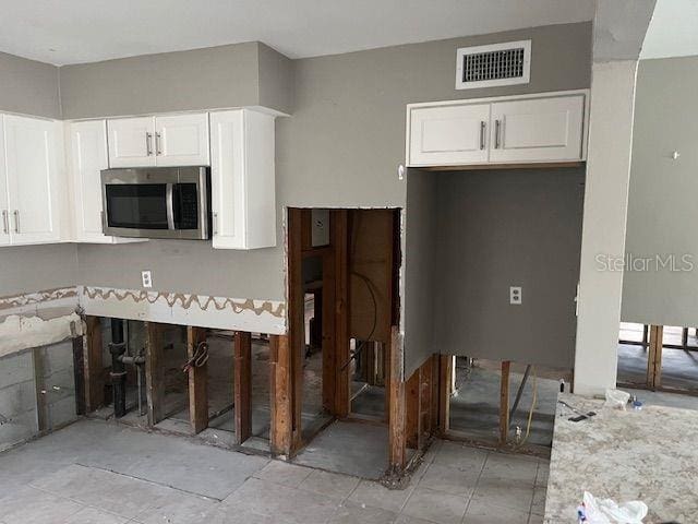 kitchen featuring white cabinetry