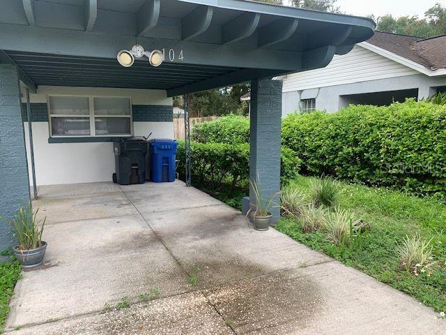 exterior space with a carport