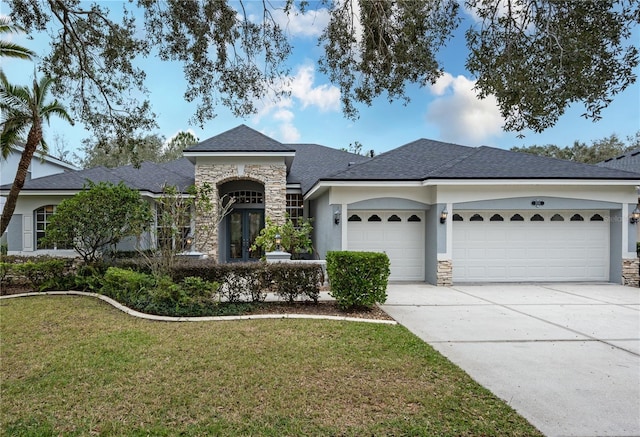 single story home with a garage and a front yard