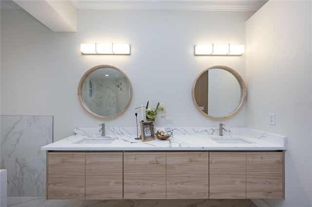 bathroom featuring crown molding and vanity