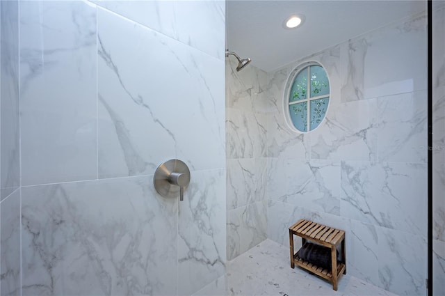 bathroom with a tile shower