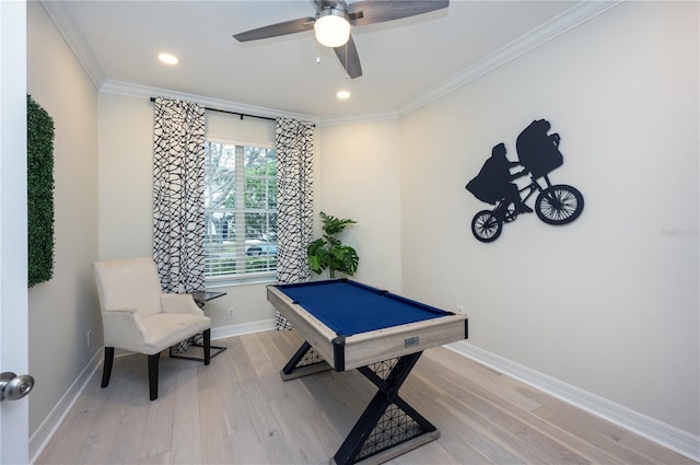 playroom featuring light hardwood / wood-style floors, ornamental molding, and pool table