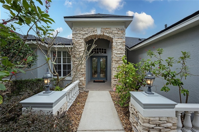 view of exterior entry featuring french doors