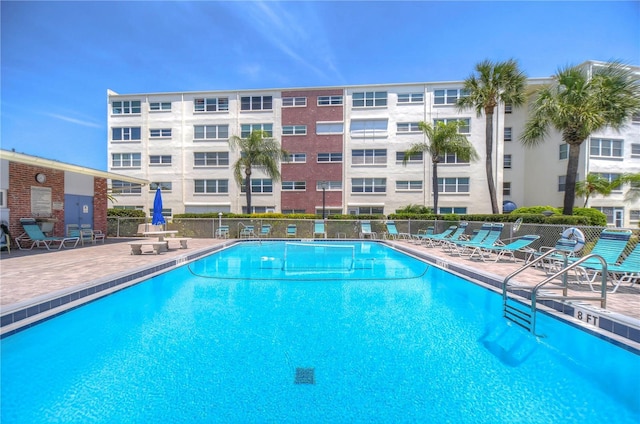 view of swimming pool with a patio area