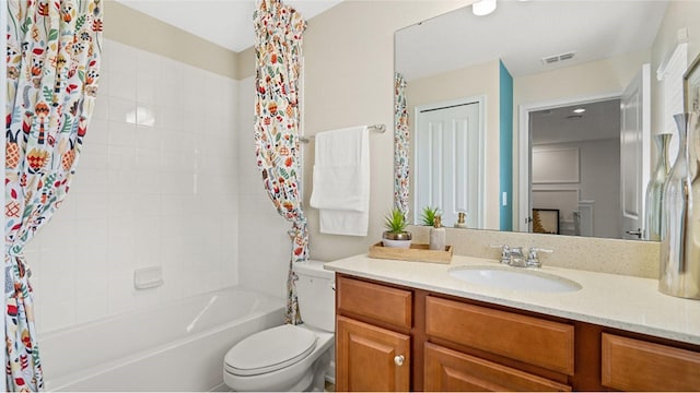 full bathroom with vanity, toilet, and shower / bath combo with shower curtain