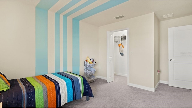 bedroom featuring light carpet