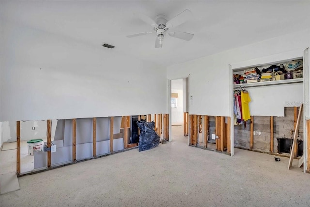 unfurnished room with a ceiling fan and visible vents