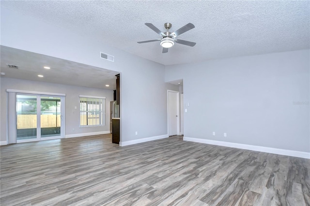 unfurnished room featuring light hardwood / wood-style floors, a textured ceiling, and ceiling fan