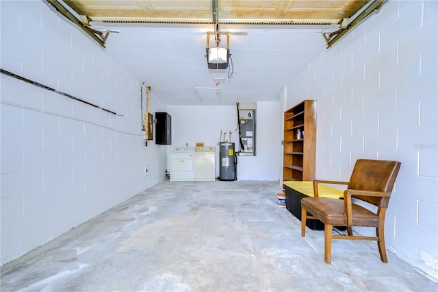 garage featuring a garage door opener, water heater, independent washer and dryer, and electric panel