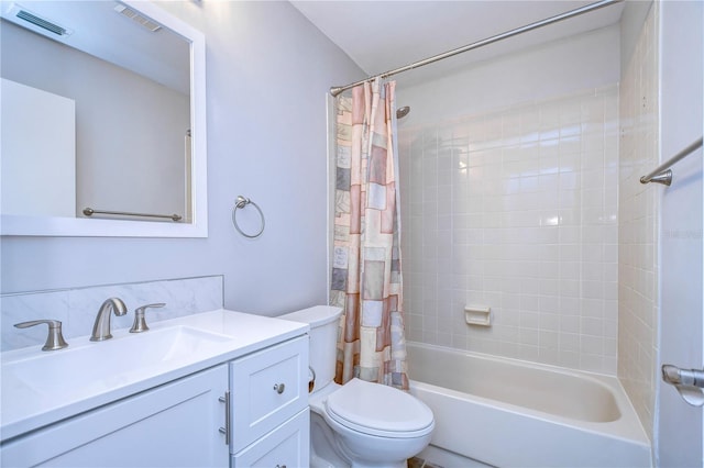 full bathroom featuring toilet, vanity, and shower / bath combo with shower curtain