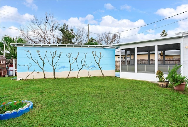 view of yard with a sunroom