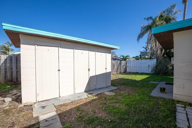 view of outbuilding featuring a yard