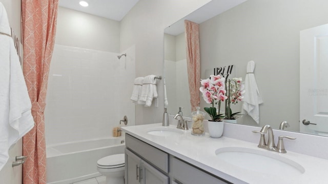 full bathroom featuring tile patterned floors, vanity, shower / bathtub combination, and toilet