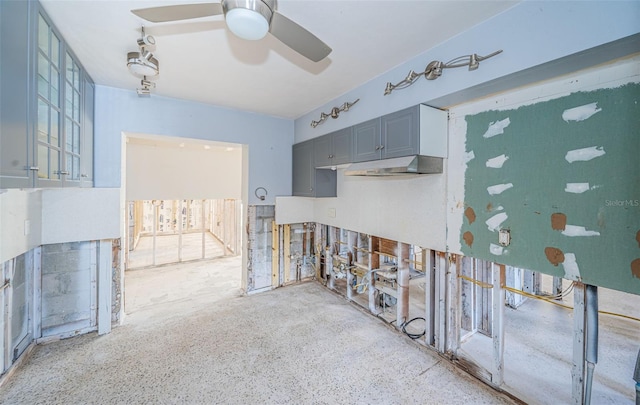 kitchen with gray cabinetry, ceiling fan, and a healthy amount of sunlight