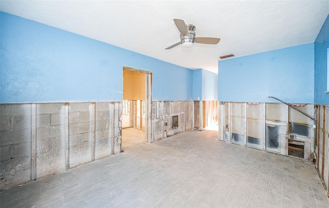 interior space with ceiling fan and hardwood / wood-style flooring