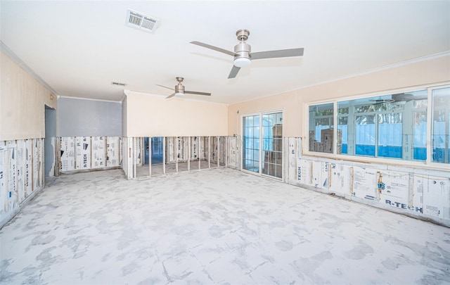 unfurnished room with ceiling fan and crown molding