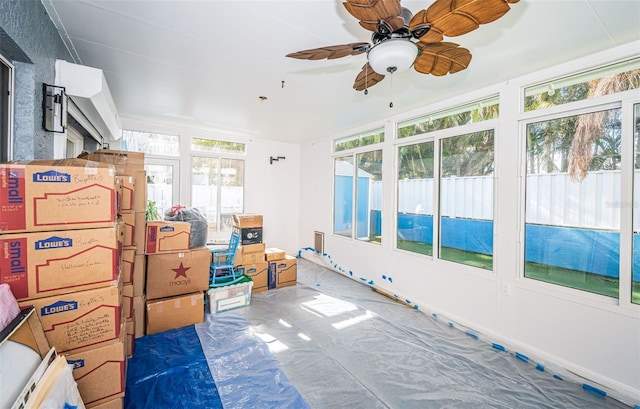 sunroom / solarium with ceiling fan