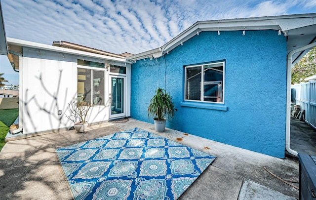 rear view of property with a patio area