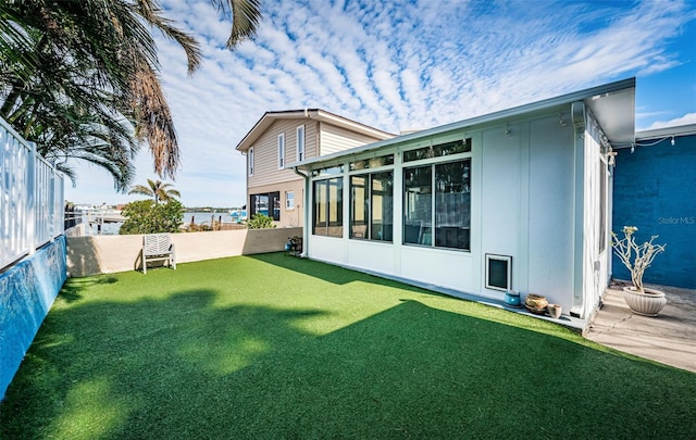 back of house featuring a yard