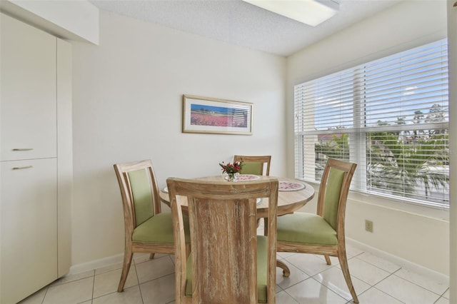 dining space with light tile patterned floors