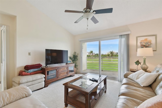 living room featuring ceiling fan, light carpet, and lofted ceiling