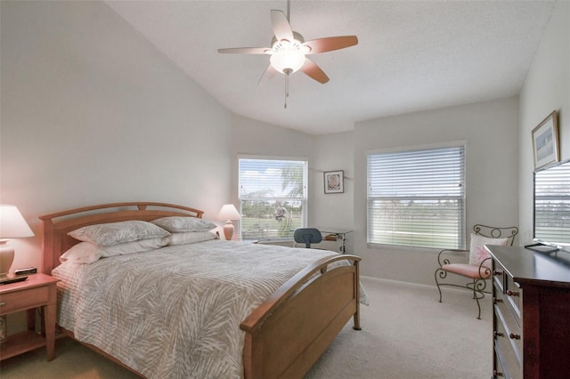 bedroom featuring ceiling fan, light carpet, and vaulted ceiling