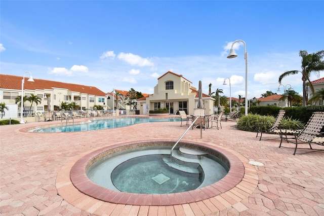 view of pool featuring a hot tub