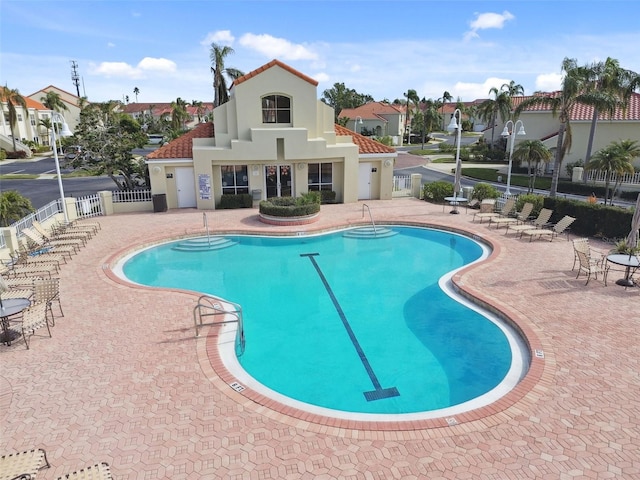 view of swimming pool with a patio