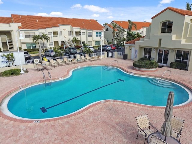 view of swimming pool with a patio area