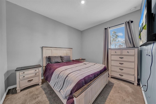 bedroom with light colored carpet