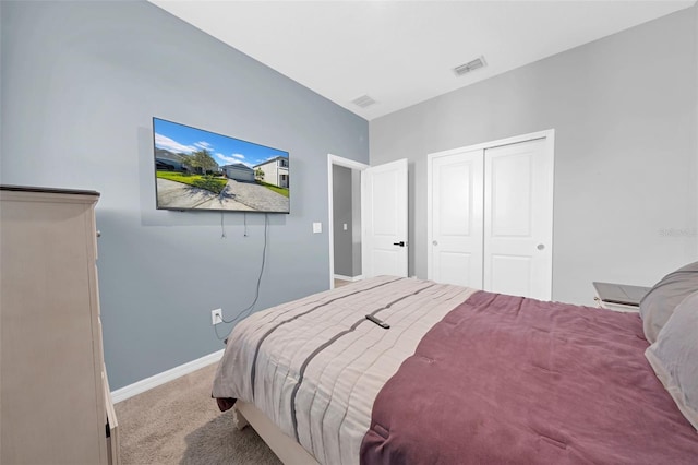 carpeted bedroom with a closet